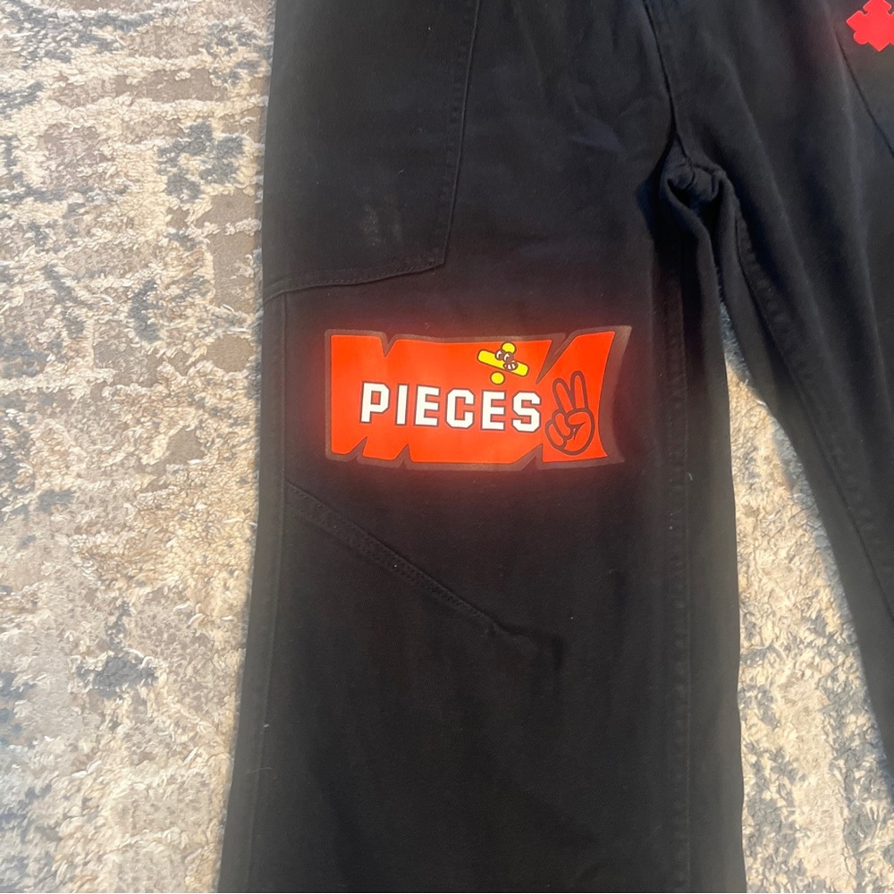 11KN Black Cargo Pants Size medium Stars Pass By Leave Traces Puzzles - Picture 2 of 14